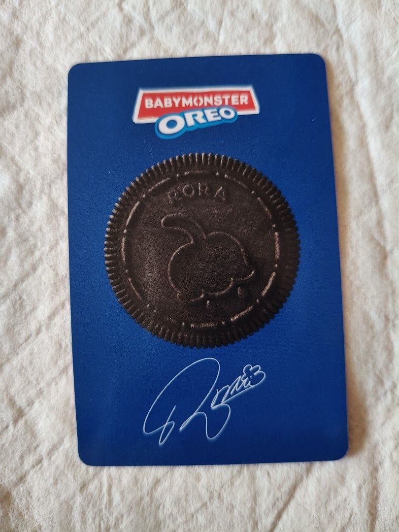 BABYMONSTER OREO Photocard RORA (Category: K-Wave Merchandise) located in Quezon City. Submitted by miletdeclutters (Listing ID 1412894959, Image 2). Description: - BABYMONSTER RORA OREO Photocard - Features RORA on the front - Back includes BABYMONSTER OREO logo, Oreo image, and RORA's signature - Collectible item for fans.