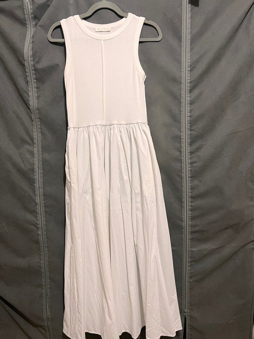 BKK White Sleeveless Dress (Category: Dresses) located in Taguig. Submitted by eybi.ph (Listing ID 1412944146, Image 1). Description: - can fit medium to large frame - Features a round neckline - Gathered skirt design - Includes pockets - Ribbed bodice - Flowing skirt - Minor stains present - Perfect for casual outings.