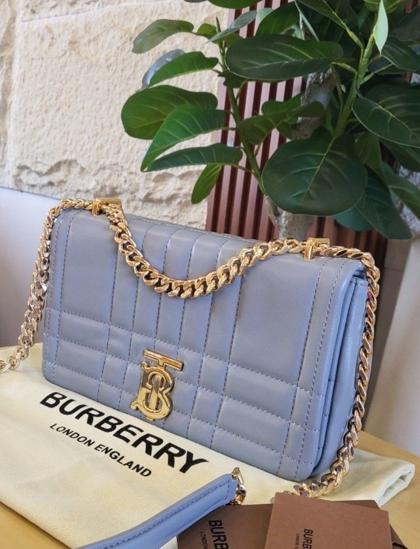 Burberry Lola Quilted Bag (Category: Luxury Bags & Wallets) located in Manila. Submitted by ddidl (Listing ID 1412978847, Image 1). Description: - NGA, Japan Sourced - Quilted design - Gold-tone chain strap - Flap closure with TB logo - Interior lined - "Made in Italy" label - Includes dust bag - Color: Light blue/grey location: Manila or Pasay. can do lalamove or grab MOP: BDO and Gcash only.