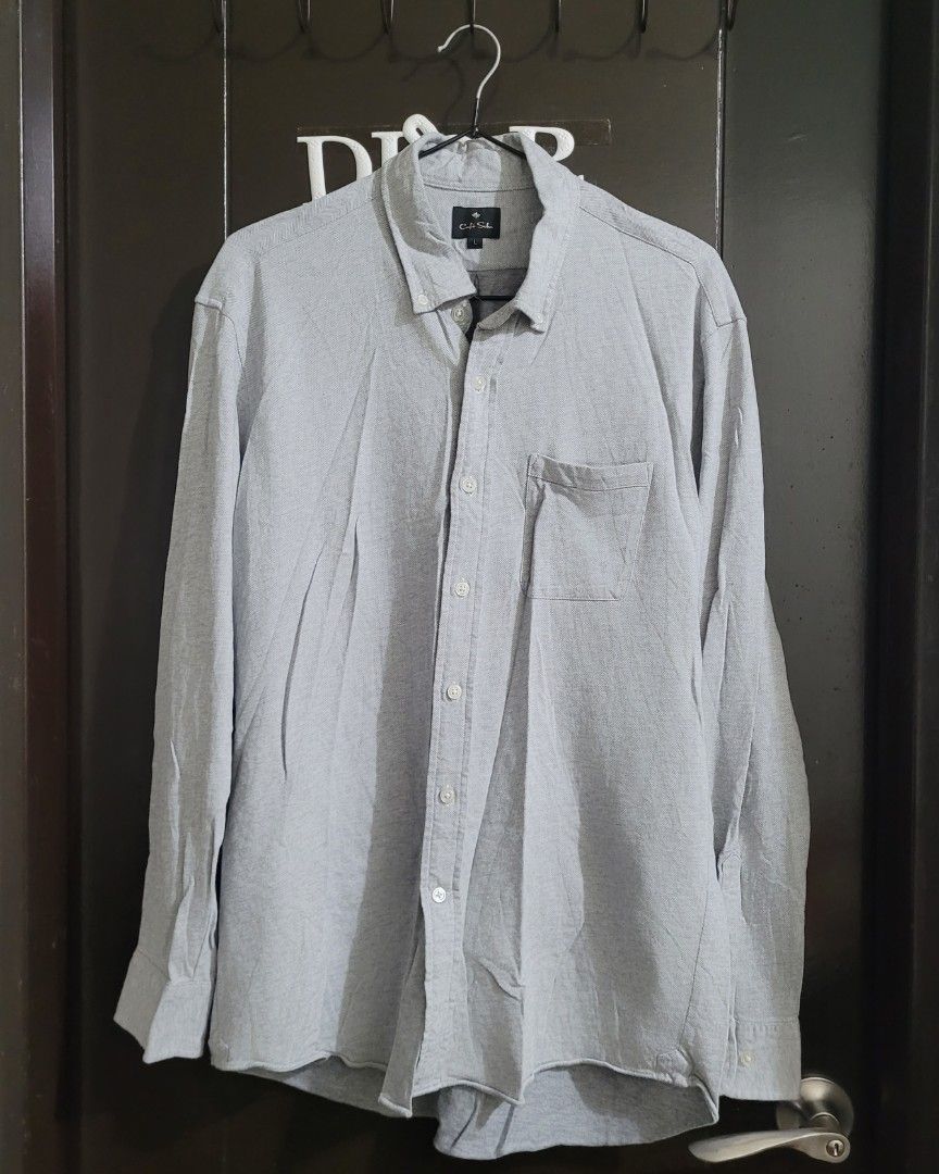 Cafe Soho Long Sleeve Shirt - Gray (Category: Longsleeves) located in Paranaque City. Submitted by mariam3842 (Listing ID 1413028965, Image 3). Description: Cafe Soho long sleeve shirt in gray. Features a button-down closure, a chest pocket, and buttoned cuffs. The shirt has a herringbone pattern. Size L. "Note: The first photo is an AI-generated model for fit and styling reference only. The remaining photos show the exact item you will receive."