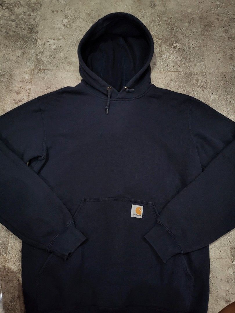 Carhartt Hoodie - Navy Blue (Category: Hoodies) located in Baguio. Submitted by lakobado05766 (Listing ID 1412964021, Image 2). Description: - Carhartt navy blue hoodie - Size: Small - Features: - Hood with drawstring - Front pocket - Carhartt logo patch - Material: Cotton/Polyester blend - Ribbed cuffs and hem - Made in Honduras.