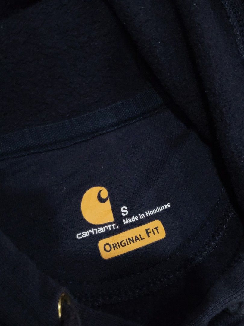 Carhartt Hoodie - Navy Blue (Category: Hoodies) located in Baguio. Submitted by lakobado05766 (Listing ID 1412964021, Image 3). Description: - Carhartt navy blue hoodie - Size: Small - Features: - Hood with drawstring - Front pocket - Carhartt logo patch - Material: Cotton/Polyester blend - Ribbed cuffs and hem - Made in Honduras.