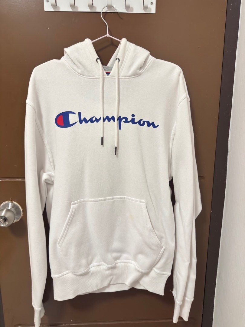 Champion Hoodie - White (Category: Hoodies) located in Caloocan City. Submitted by shop.ae (Listing ID 1412882794, Image 1). Description: - Champion hoodie - Size: Small (S) - Features the Champion logo - Kangaroo pocket - Drawstring hood - Grey inner hood lining - Classic and comfortable design.