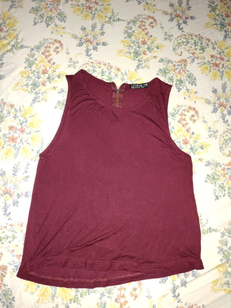 Cotton On Top (maroon) (Category: Sleeveless) located in Caloocan City. Submitted by bluschlez (Listing ID 1412964463, Image 1). Description: maroon zips at the back issue: pinhole (pls see 3rd pic) not obvious size xs but fits up to medium 95% viscose 5% elastane.