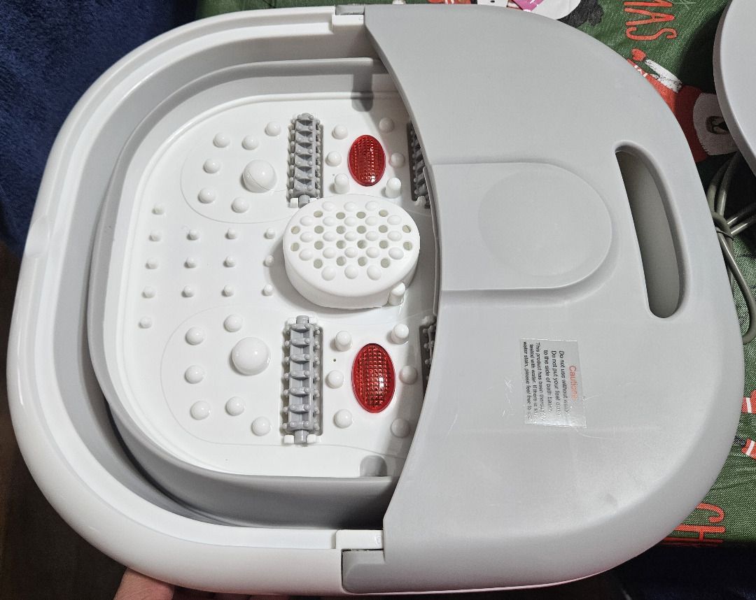 Folding Foot Bath (Category: Massage Devices) located in Manila. Submitted by KuWeLaDevil01 (Listing ID 1412924195, Image 3). Description: Have not tested the equipment, just took photos. It features automatic heating, magnetic therapy and roller massage. There are ten (10) packs of bath salts included, even if nine (9) are pictured. RFS: Was supposed to be a housewarming gift for a couple who has decided to live-in together. Turns out, one of th