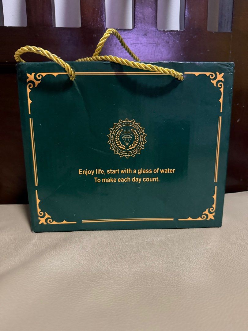 Green Ceramic Mug Set with Lid and Teddy Bear (Category: Coffee & Tea Tableware) located in Manila. Submitted by eksenadora (Listing ID 1412862648, Image 2). Description: - Green ceramic mug with lid - Features a 'lucky' print - Includes a small teddy bear - Comes in a gift box with a gold rope handle - Gift box includes the quote: "Enjoy life, start with a glass of water to make each day count." Location: Sampaloc, Manila Price: P200 MOP: gcash 