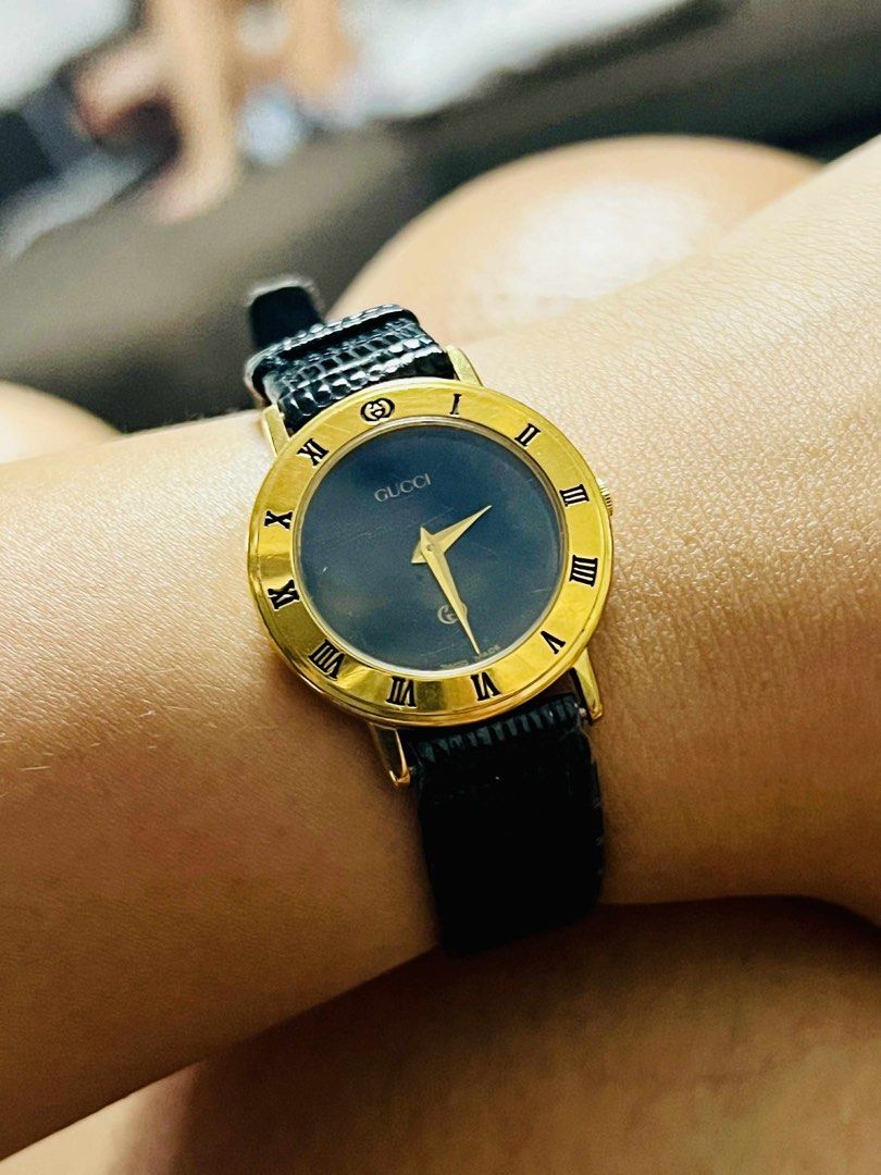 Gucci Gold Watch with Black Strap (Category: Women's Watches) located in Manila. Submitted by cessgapusan (Listing ID 1413008013, Image 1). Description: - original Gucci watch - Gold-toned case - Roman numeral hour markers - Gold hands - Black leather strap - Gucci logo visible - Classic and stylish No box It is a 2nd hand so expect a signs of usage. .