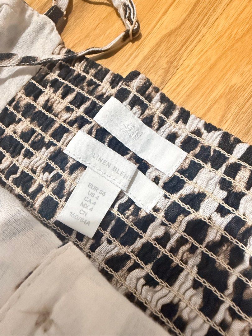 H&M Linen Blend Leopard Print Dress (Category: Dresses) located in Caloocan City. Submitted by MSCloset_ (Listing ID 1412951949, Image 2). Description: - H&M Leopard Print Dress - Adjustable straps - Button-down front - Linen blend fabric - Midi length - Size: EUR 36, US 4, CA 4, CN 160/84A.