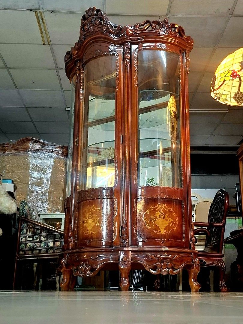 Italian Curio Cabinet (Category: Shelves, Cabinets & Racks) located in Malabon City. Submitted by justineevglst (Listing ID 1413010386, Image 3). Description: - Italian curio cabinet - Rich, dark wood finish - Intricate carvings - Glass doors and shelves - Perfect for displaying collectibles - Dimensions: 79" height, 42" width, 18" depth - Origin: Japan.