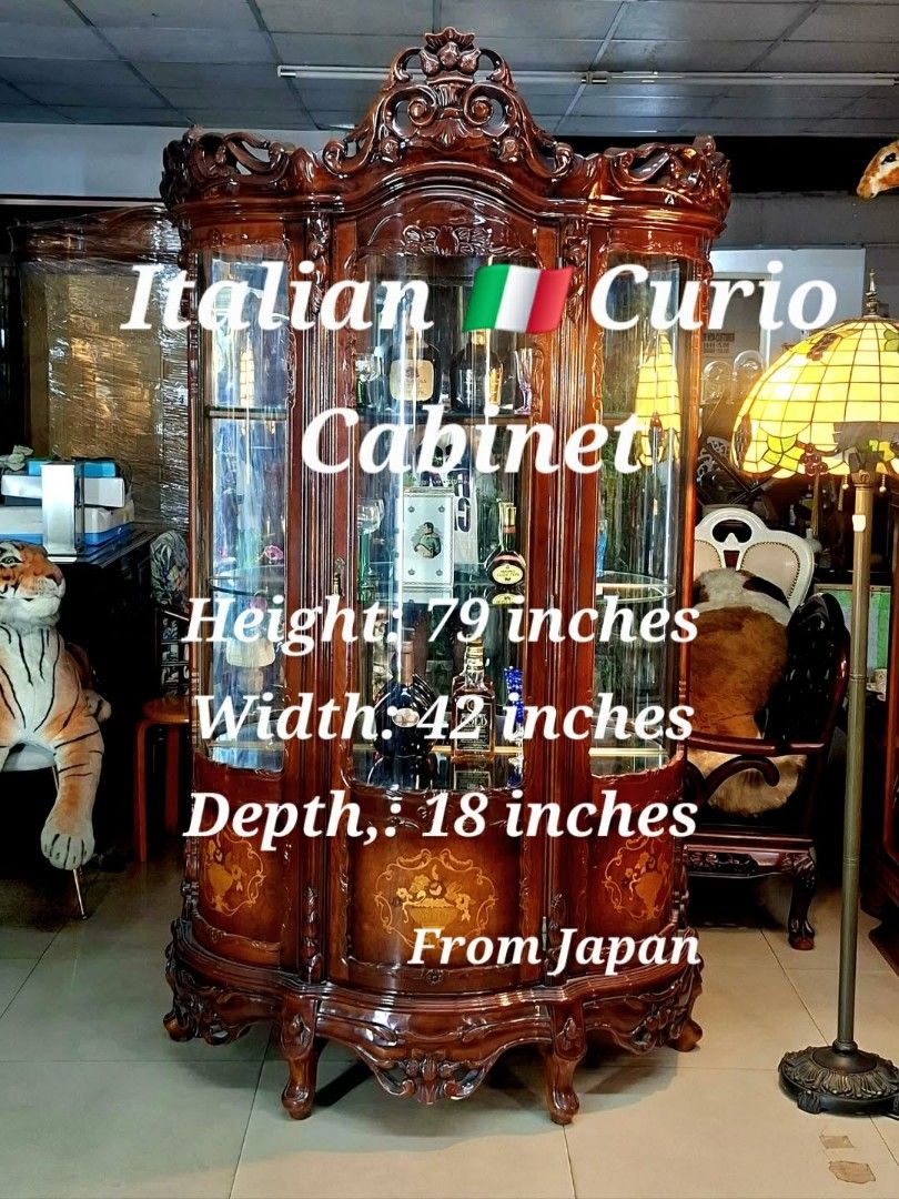 Italian Curio Cabinet (Category: Shelves, Cabinets & Racks) located in Malabon City. Submitted by justineevglst (Listing ID 1413010386, Image 2). Description: - Italian curio cabinet - Rich, dark wood finish - Intricate carvings - Glass doors and shelves - Perfect for displaying collectibles - Dimensions: 79" height, 42" width, 18" depth - Origin: Japan.