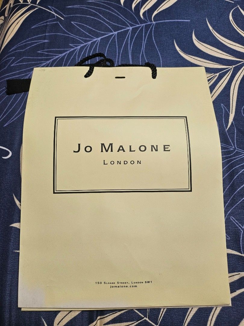 Jo Malone Paper Bag (Category: Fragrance & Deodorants) located in Makati City. Submitted by shopdoc (Listing ID 1412914240, Image 1). Description: -2 large Authentic Jo Malone paper bag. - Features classic Jo Malone branding. - In good condition. - Sturdy handles. - Perfect for gifting or personal use..
