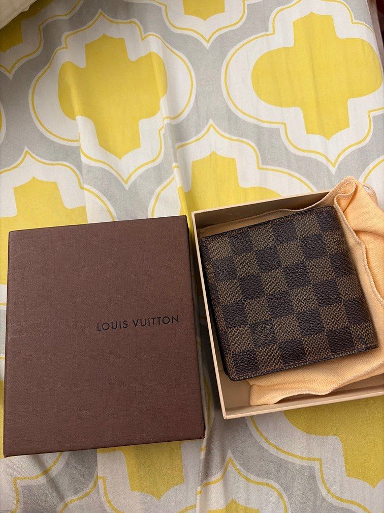 Louis Vuitton Monogram wallet (Category: Luxury Bags & Wallets) located in Binan City. Submitted by spec.a (Listing ID 1412860754, Image 2). Description: Unisex wallet with coin purse Damier Ebene LV wallet If interested feel free to DM :) Local purchase from Luis Vuitton boutique in Makati Pm if interested for the Price.