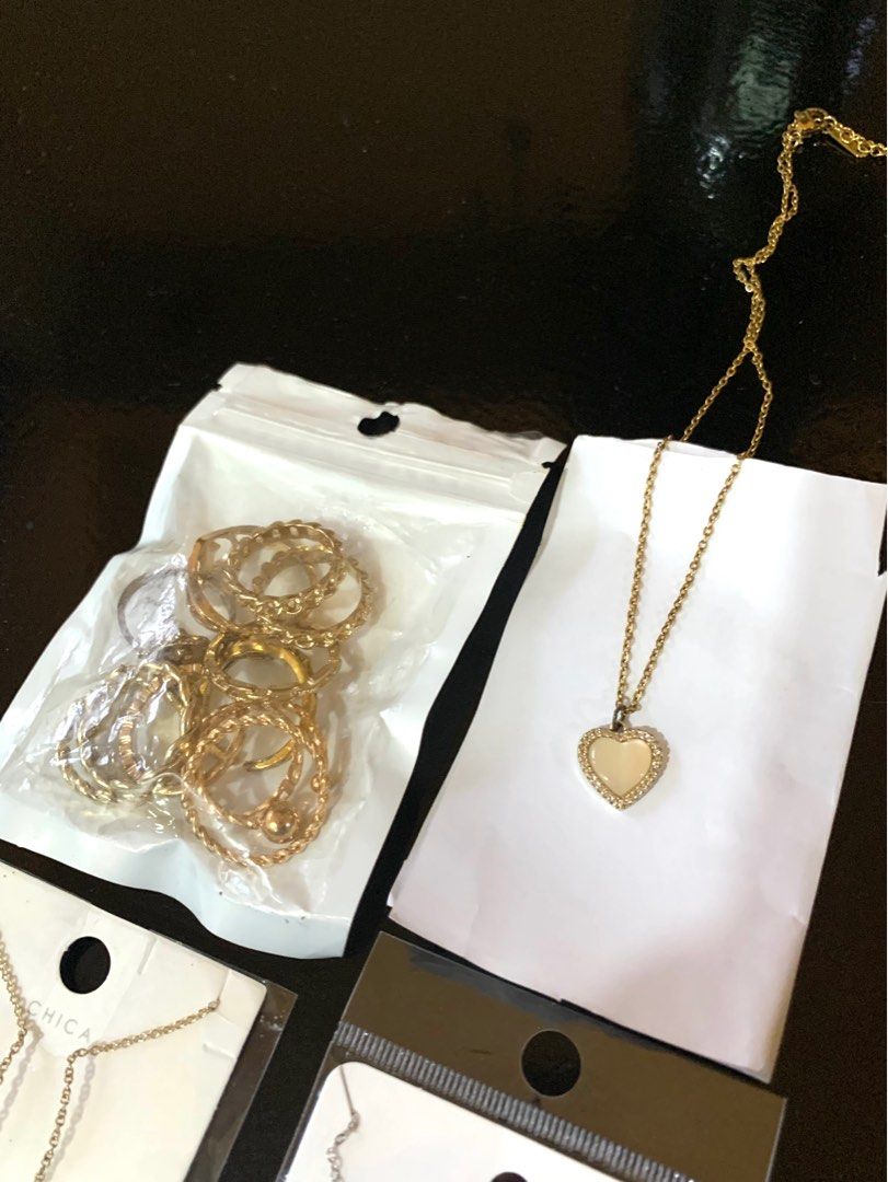 Necklace and Rings Jewelry Bundle (Category: Necklaces) located in Pasig City. Submitted by beans123_ (Listing ID 1412960899, Image 3). Description: Jewelry Set ✨ - Heart pendant necklace - Silver circle pendant necklace (stainless steel) - Stone necklace - Gold rings Set Never worn out, just tried once to check the sizes .