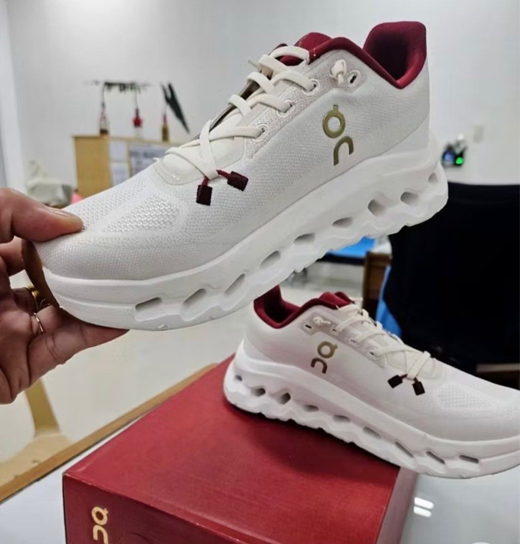 OC UA Running Shoes White Red (Category: Sneakers) located in Manila. Submitted by wantoneyyt18 (Listing ID 1413025960, Image 2). Description: Size 40 - On Cloudnova running shoes - Color: White with red accents - Features the On logo - Unique sole design - No damage condition - Comes with original box.