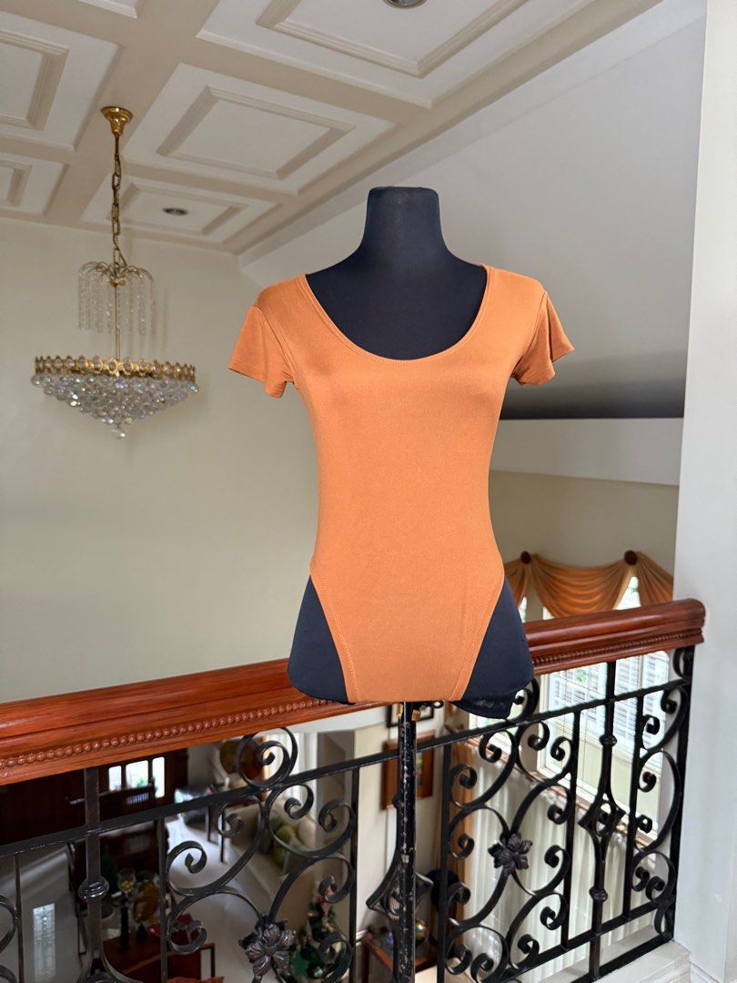 Orange Swimmy Fit Bodycon top (Category: Blouses) located in Makati City. Submitted by VersatileBabe (Listing ID 1413028601, Image 3). Description: .