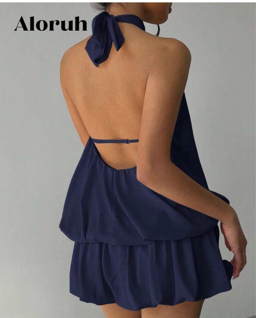 Ruffle Hem Halter Neck Mini Dress (Category: Dresses) located in Rizal. Submitted by preluvjay (Listing ID 1412883452, Image 2). Description: - Aloruh halter top - Navy blue color - High neckline - Flowing silhouette - Halter tie at the back - Gathered waist detail - Perfect for a casual look - Only worn once.