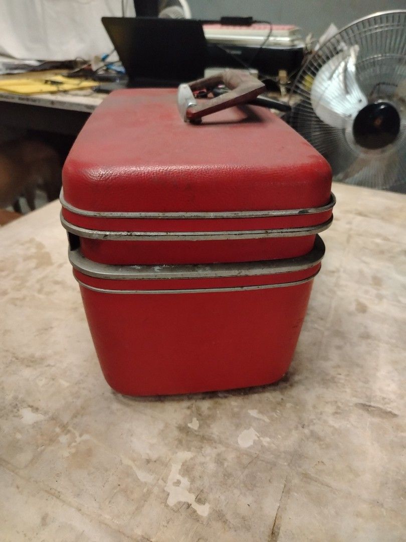Samsonite Red Vanity Case (Category: Luxury Bags & Wallets) located in Quezon City. Submitted by mary.marcel (Listing ID 1412883733, Image 2). Description: Decluttering price negotiable - Vintage Samsonite vanity case - Classic red color - Features Samsonite logo on handle - Tan interior lining - Includes compartments and pockets - Removable tray - Metal accents and clasps.