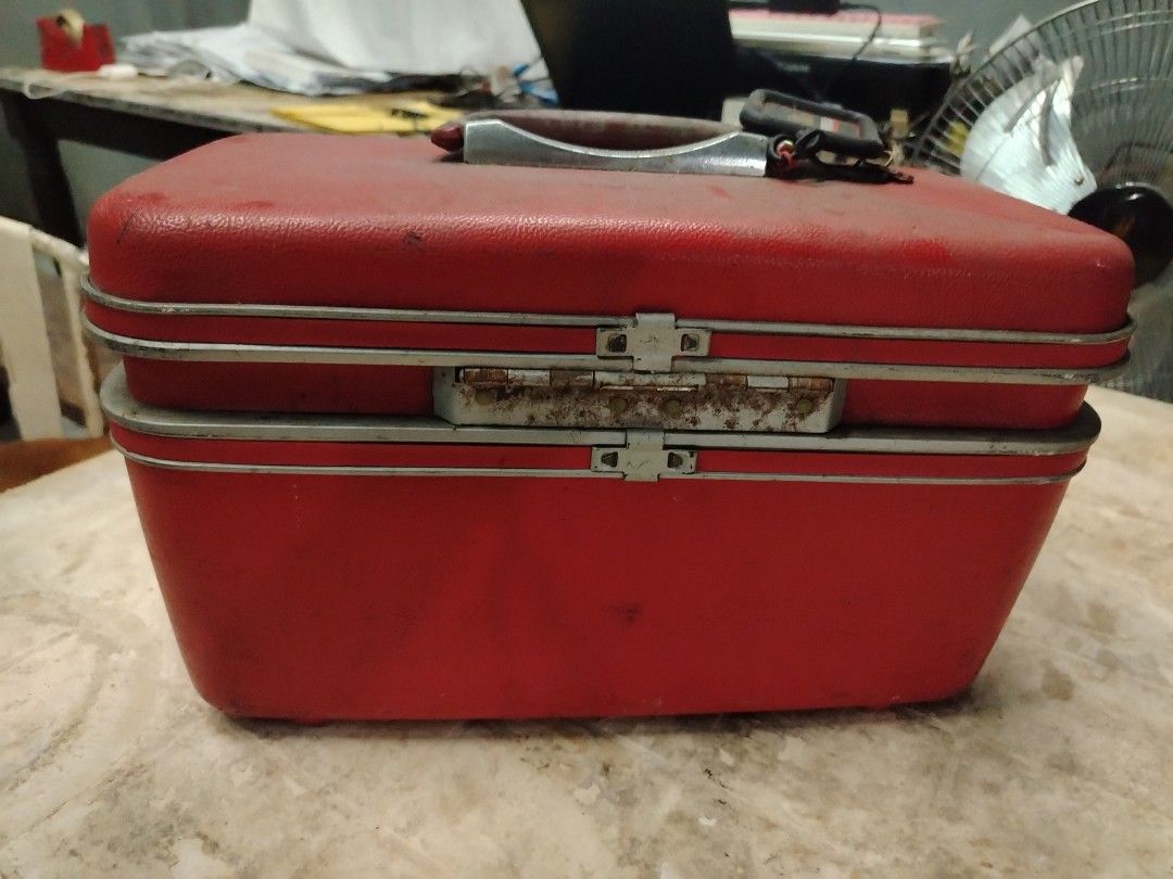 Samsonite Red Vanity Case (Category: Luxury Bags & Wallets) located in Quezon City. Submitted by mary.marcel (Listing ID 1412883733, Image 3). Description: Decluttering price negotiable - Vintage Samsonite vanity case - Classic red color - Features Samsonite logo on handle - Tan interior lining - Includes compartments and pockets - Removable tray - Metal accents and clasps.