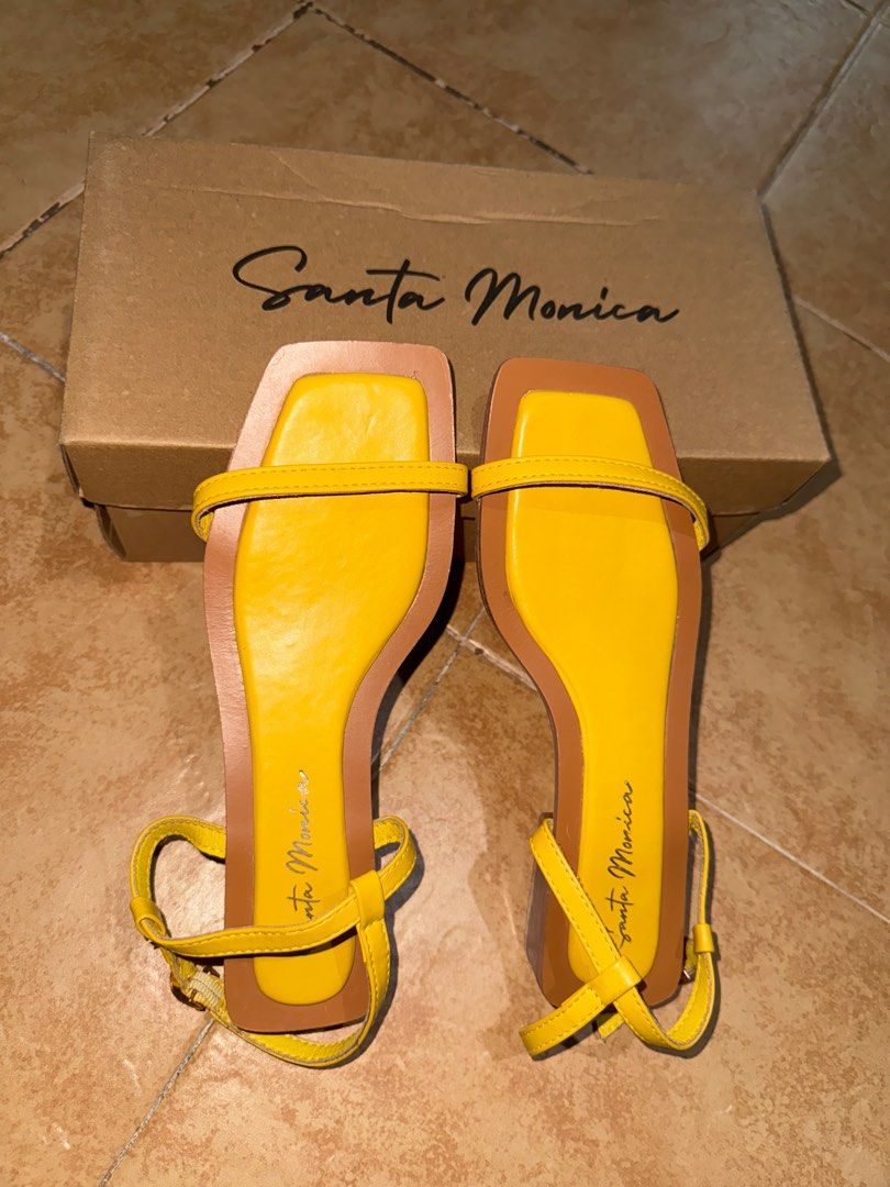 Sandal Square Toe Yellow (Category: Flats & Sandals) located in Manila. Submitted by avmhof18 (Listing ID 1412955683, Image 1). Description: Style: Square Toe Sandal Color: Yellow Size: 6 Inclusion: Sandals with box Santa Monica shoes bought from Payless Store. Original price: 1,495 Selling at a low price of 250 due to signs of usage and a minimal flaw, as shown in the photo. Still in good wearable condition and perfect for everyday use. Reason f