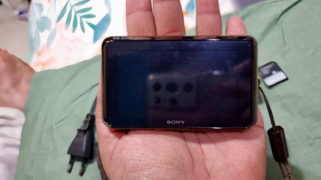 Sony Cyber-shot DSC-T99D Digital Camera (Category: Cameras) located in Tuguegarao City. Submitted by alexandra453 (Listing ID 1395849848, Image 2). Description: - Sony Cyber-shot DSC-T99D - Includes charger, battery, and 4GB memory card (all original and its own) - Comes with original wrist strap and stylus -English by default -Chat me for sample photos (photo aesthetics depends on camera settings) or search online -First owner Body condition: 9.