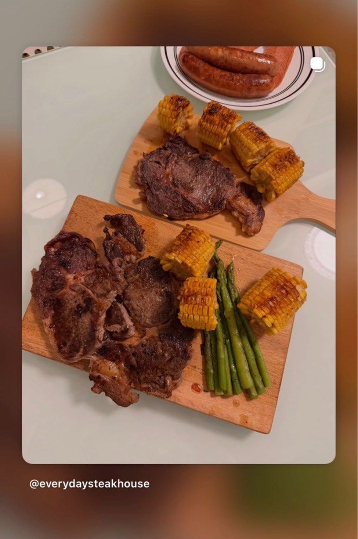 STEAKS USDA (Category: Other Food & Drinks) located in Quezon City. Submitted by nats888 (Listing ID 1412949488, Image 1). Description: - Delicious grilled steak - Served with grilled corn, asparagus, and sausages - Perfect for a hearty meal - Presented on wooden boards - Includes a plate of sausages - Ready to enjoy!.