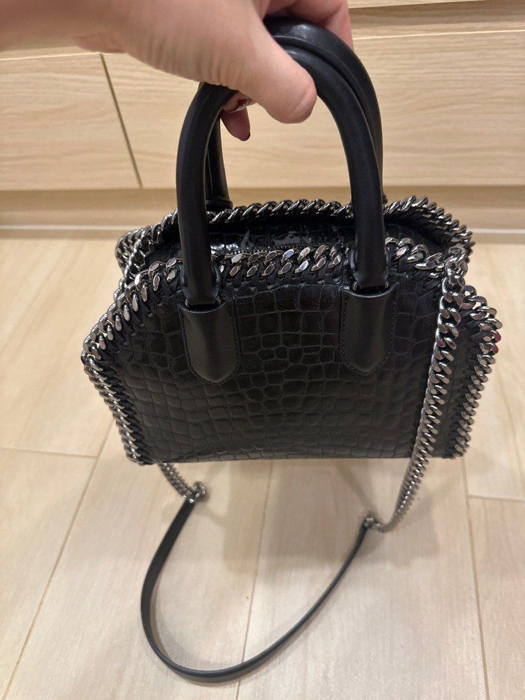 Stella McCartney Falabella Box Top handle with strap (Category: Luxury Bags & Wallets) located in Manila. Submitted by stashandslay (Listing ID 1412928067, Image 3). Description: Selling Low 💕 Slightly used and well-loved, but never abused. The leather near the zipper has developed some cracking and chipping due to humidity while in storage (please see photos for the condition). Priced low to reflect the flaw. ✨ Comes with dust bag and cards. Pl