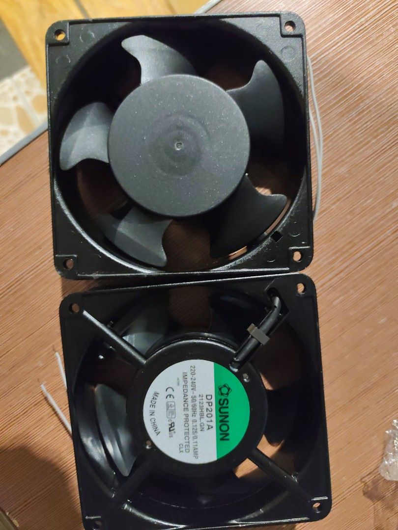 Sunon DP201A Fan - AC Axial fan (Category: Industrial Equipment) located in Manila. Submitted by peterjohn00008 (Listing ID 1412980700, Image 2). Description: - Sunon DP201A fans - Black frame and blades - 220-240V, 50/60Hz, 14W - Square shape - Includes wires for connection - Sunon brand - 500 for both.