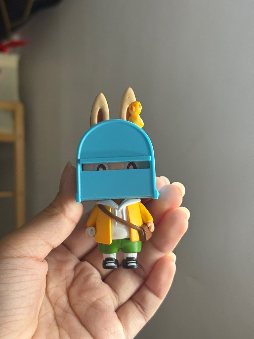 The Monsters Mailbox Bunny Figure (Category: Designer & Blind Box Toys) located in Quezon City. Submitted by angelolol (Listing ID 1412997125, Image 1). Description: - Adorable bunny figure - Features a mailbox-shaped head - Wears a yellow jacket and green shorts - Includes a small bag - Comes with a small yellow duck.