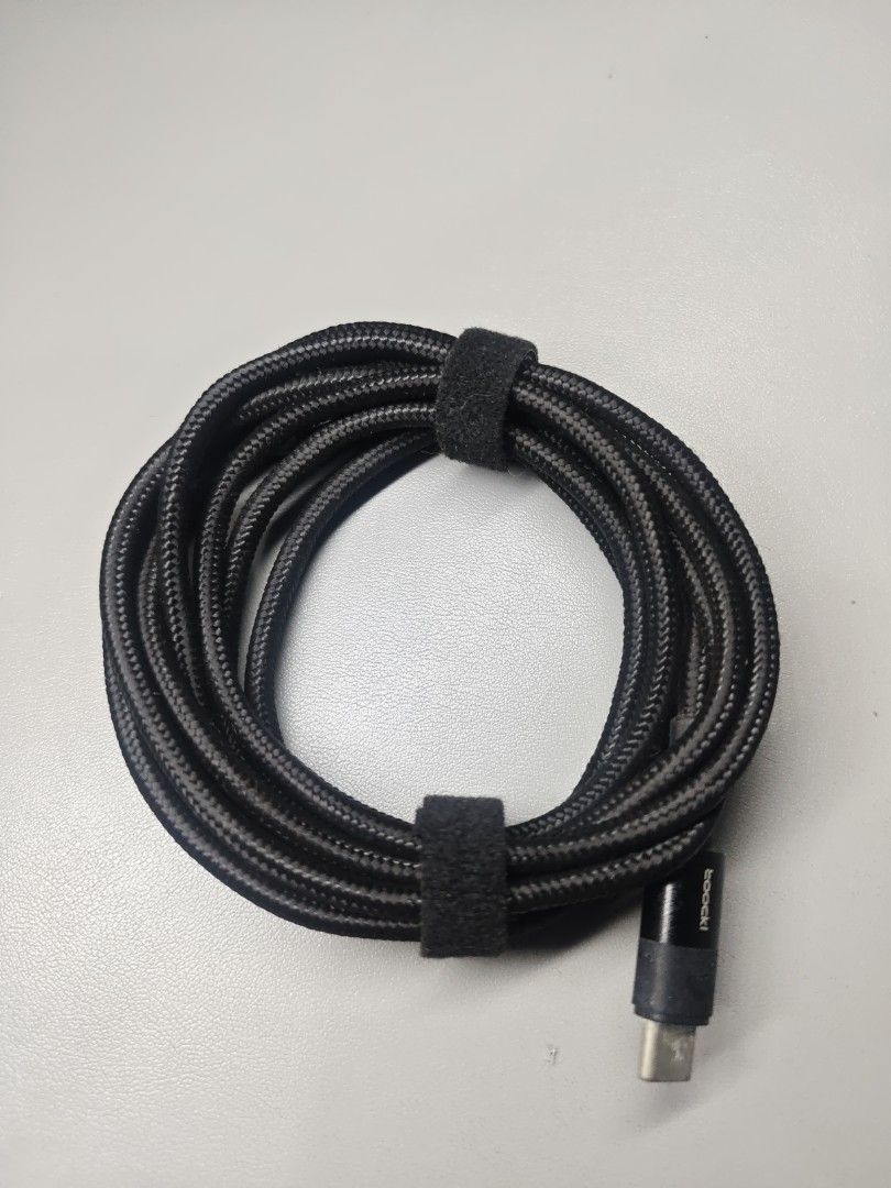 Toocki 100W 2 meters USB Type C to USB Type C Cable (Category: Chargers & Cables) located in Makati City. Submitted by tekhowz (Listing ID 1412938884, Image 1). Description: Toocki USB-C cable. It has a black braided design. The cable is neatly coiled and secured with a velcro strap. 100 Watts. Length 2 meters.