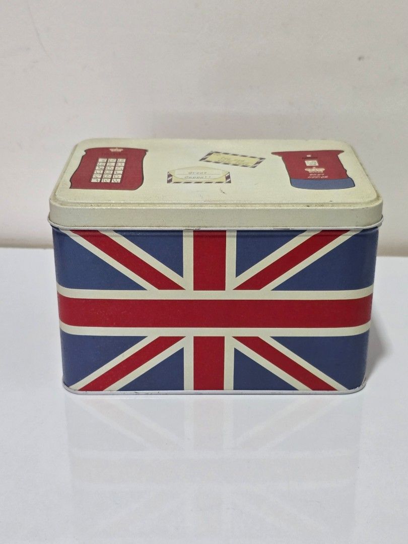 UK-inspired Storage Tin Boxes Organizers (Category: Storage Boxes & Baskets) located in San Fernando. Submitted by sophmng (Listing ID 1412916968, Image 3). Description: Price listed is for the SET! - UK-inspired storage tin boxes. - Features iconic British designs (Union Jack, phone booths, guards). - Stylish and functional. - Perfect for organizing small items. Big box dimensions: 19cm L x 13.5cm D x 12.5cmH Small box dimensions: 14.5cm L x 10.