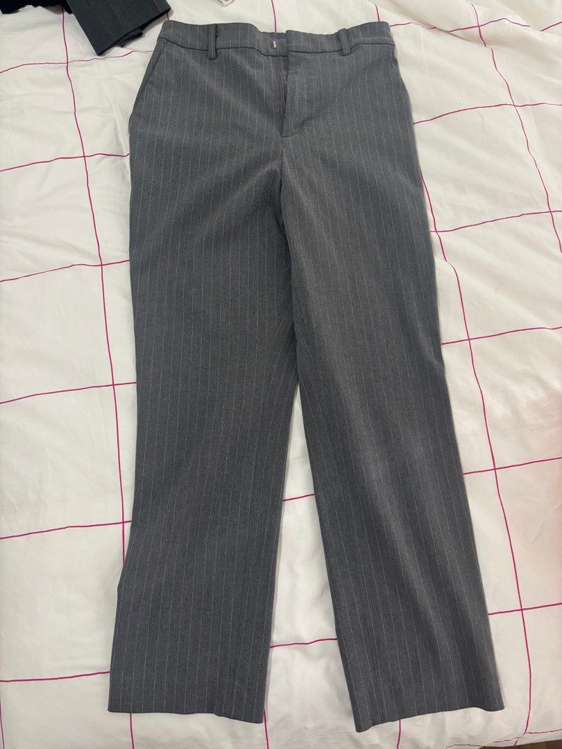 Uniqlo Pinstripe Pants - Size S (Category: Other Bottoms) located in Quezon City. Submitted by smgss (Listing ID 1412994773, Image 1). Description: Uniqlo pinstripe pants in size S. Made of 48% polyester and 4% spandex. Waist is 60-66cm and hips are 85-91cm. The pants are gray with vertical stripes. They have a classic, straight-leg cut. Perfect for a professional or casual look..