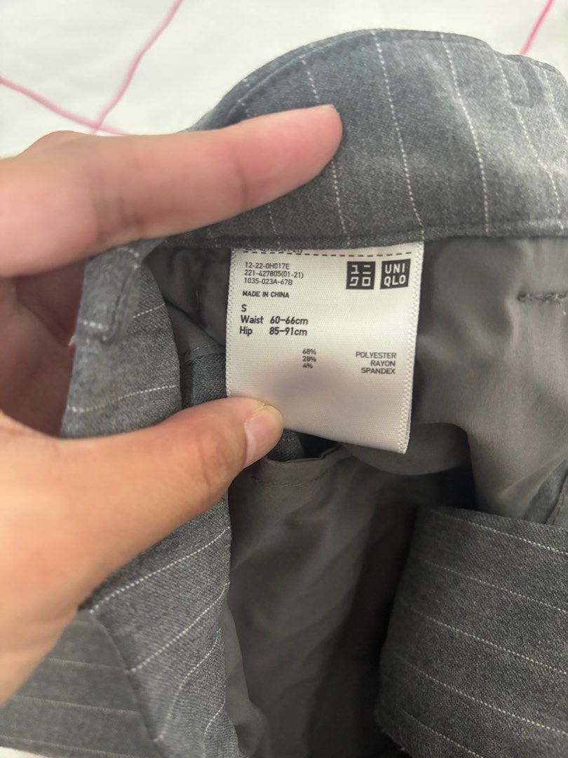 Uniqlo Pinstripe Pants - Size S (Category: Other Bottoms) located in Quezon City. Submitted by smgss (Listing ID 1412994773, Image 2). Description: Uniqlo pinstripe pants in size S. Made of 48% polyester and 4% spandex. Waist is 60-66cm and hips are 85-91cm. The pants are gray with vertical stripes. They have a classic, straight-leg cut. Perfect for a professional or casual look..