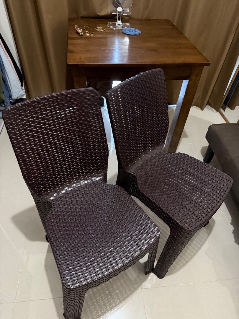 Wooden Dining Table with 2 Chairs (Category: Tables & Sets) located in Pasig City. Submitted by octavarose (Listing ID 1413019547, Image 2). Description: - Dining set includes: - Wooden table with a drawer - Two chairs - Table and chairs are dark brown. - Chairs made of woven plastic - Ideal for small dining areas.