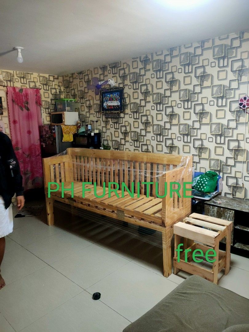 Wooden Sofa conver to single bed with Side Table (Category: Sofas) located in Manila. Submitted by jovetph. (Listing ID 1413025905, Image 2). Description: Wooden sofa with a matching side table. The sofa has a natural wood finish and a slatted seat and back. The side table is also made of wood and complements the sofa's design. Perfect for a living room or any space needing seating..