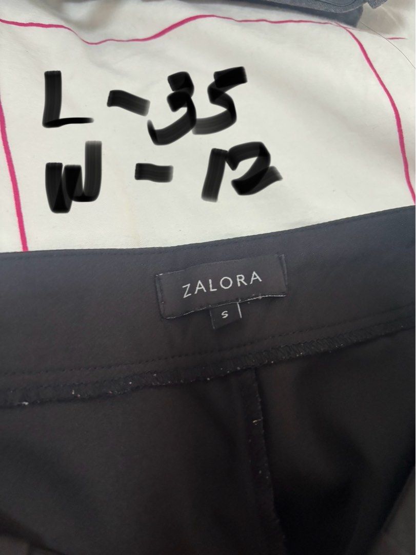 Zalora Black Wide Leg Pants (Category: Other Bottoms) located in Quezon City. Submitted by smgss (Listing ID 1412994634, Image 2). Description: - Zalora black wide-leg pants - Size: S - Features a high-waist design - Button details - Measurements: Length - 35 inches, Waist - 12 inches - Versatile and suitable for various occasions.
