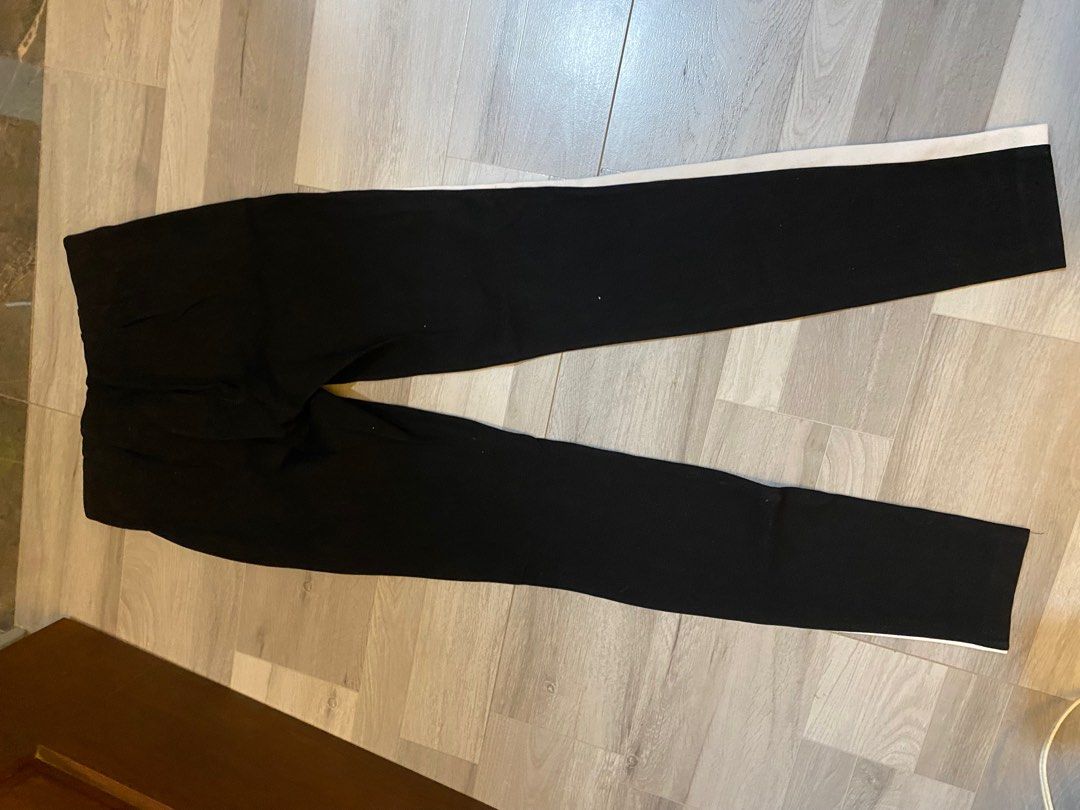 Zara Black Pants with White Side Stripe (Category: Other Bottoms) located in Manila. Submitted by yotesdg (Listing ID 1412991966, Image 2). Description: - Black slim-fit pants - White stripe detail - Stretchy material - Elastic waist - Casual wear.