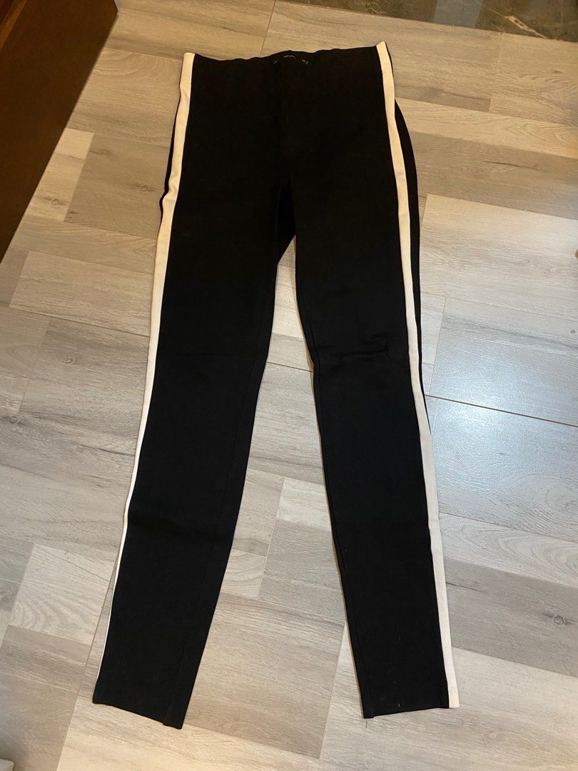Zara Black Pants with White Side Stripe (Category: Other Bottoms) located in Manila. Submitted by yotesdg (Listing ID 1412991966, Image 1). Description: - Black slim-fit pants - White stripe detail - Stretchy material - Elastic waist - Casual wear.