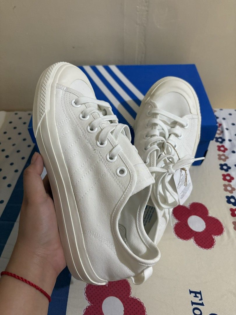 Adidas Nizza RF White Sneakers (Category: Sneakers) located in Manila. Submitted by garagesalelimited (Listing ID 1414707960, Image 2). Description: - Adidas Nizza RF sneakers - Color: White - Size: US 8 / UK 7.5 / EU 41 1/3 / JP 260 - Includes original box and tags - Features Adidas logo on the side and Nizza logo on the back - Original price: PHP 4,900.00 Reason for selling - hindi siya fit sa Girlfriend ko po. - never ito sinout or ginamit. - 