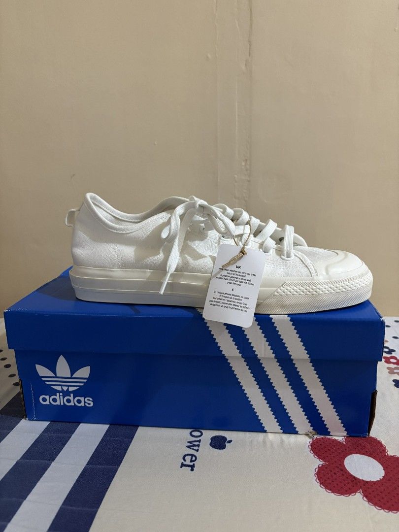 Adidas Nizza RF White Sneakers (Category: Sneakers) located in Manila. Submitted by garagesalelimited (Listing ID 1414707960, Image 1). Description: - Adidas Nizza RF sneakers - Color: White - Size: US 8 / UK 7.5 / EU 41 1/3 / JP 260 - Includes original box and tags - Features Adidas logo on the side and Nizza logo on the back - Original price: PHP 4,900.00 Reason for selling - hindi siya fit sa Girlfriend ko po. - never ito sinout or ginamit. - 