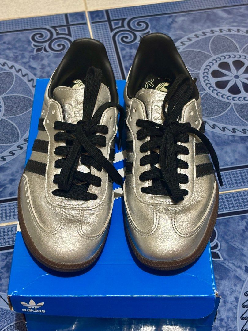 Adidas Samba OG - “Silver metallic/Black/Gum” (Category: Sneakers) located in Bayambang. Submitted by elle.declutter (Listing ID 1414797930, Image 2). Description: adidas Samba OG - Silver metallic/black/gum in WOMENS - 23.5 cm - color may vary due to lighting - mint condition (good as new) - check last slide for more info Original price: ₱6,800.00.