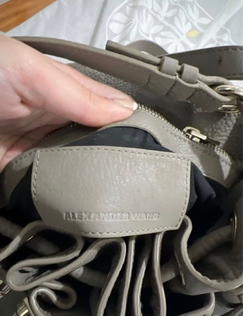 Alexander Wang Studded Diego Bucket Bag (Category: Luxury Bags & Wallets) located in Manila. Submitted by cheemishops (Listing ID 1414758087, Image 3). Description: - Alexander Wang gray bucket bag Bought this for 60k. Selling super low Barely used - Drawstring closure - Studded base - Includes shoulder strap - Interior zippered pocket - Textured leather exterior - Metal hardware accents - Black interior lining.