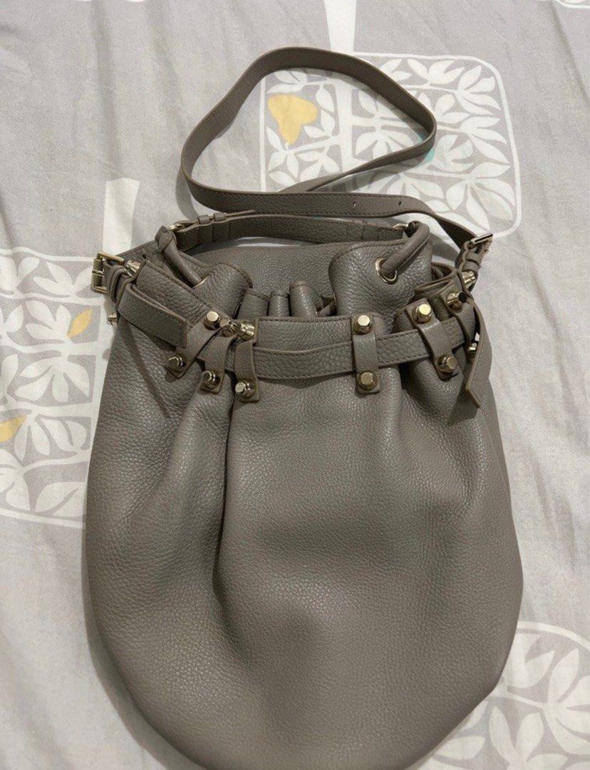 Alexander Wang Studded Diego Bucket Bag (Category: Luxury Bags & Wallets) located in Manila. Submitted by cheemishops (Listing ID 1414758087, Image 1). Description: - Alexander Wang gray bucket bag Bought this for 60k. Selling super low Barely used - Drawstring closure - Studded base - Includes shoulder strap - Interior zippered pocket - Textured leather exterior - Metal hardware accents - Black interior lining.
