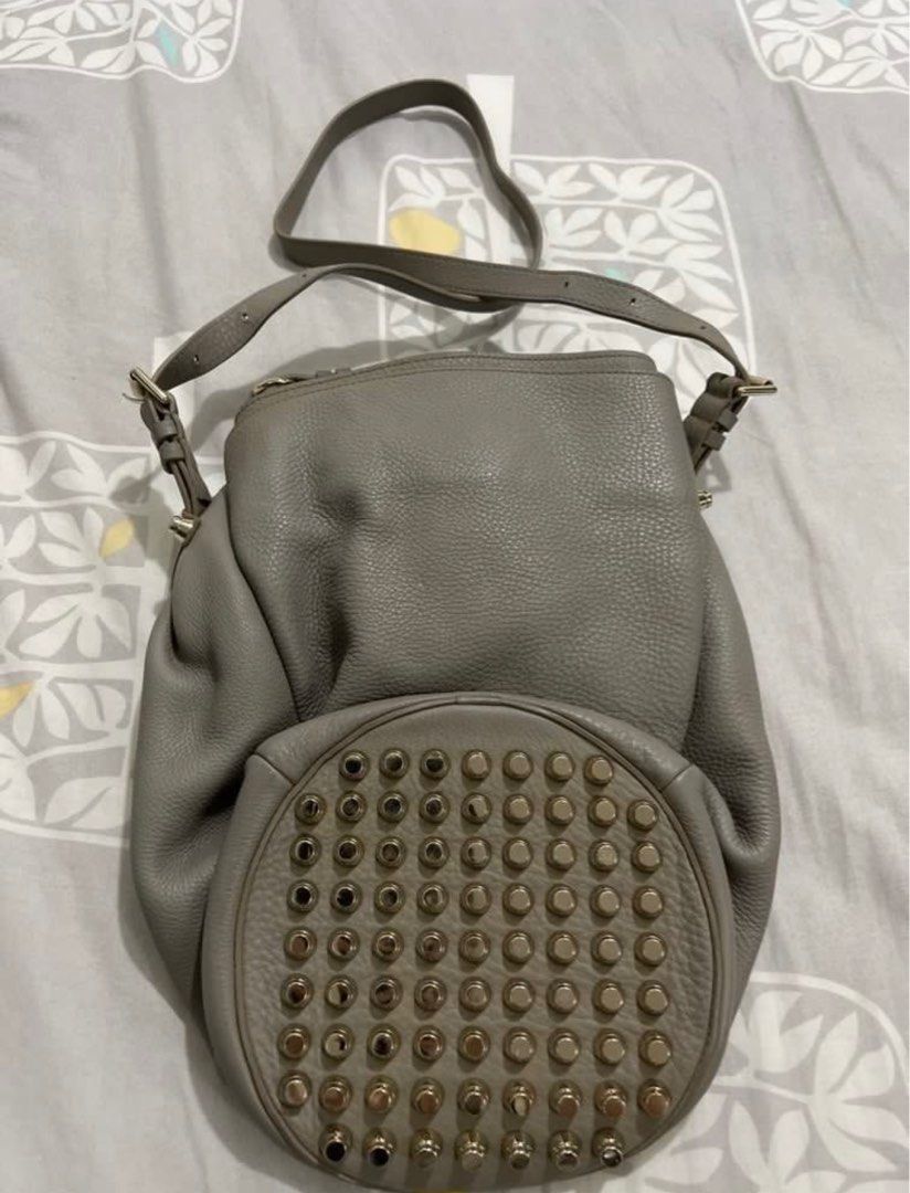 Alexander Wang Studded Diego Bucket Bag (Category: Luxury Bags & Wallets) located in Manila. Submitted by cheemishops (Listing ID 1414758087, Image 2). Description: - Alexander Wang gray bucket bag Bought this for 60k. Selling super low Barely used - Drawstring closure - Studded base - Includes shoulder strap - Interior zippered pocket - Textured leather exterior - Metal hardware accents - Black interior lining.
