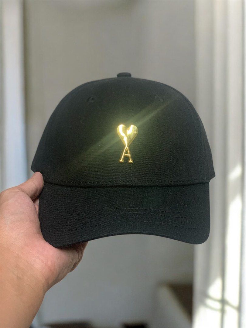 AMI MINIMALIST GOLD LOGO CAP (Category: Caps & Hats) located in Manila. Submitted by scarlett_hope (Listing ID 1414646365, Image 1). Description: 1 SIZE FITS ALL CONDITION: BNEW COLOR RATE: 10/10 MOP: GCASH ONLY COURIER: J&T OR LALAMOVE (PAYMENT FIRST).