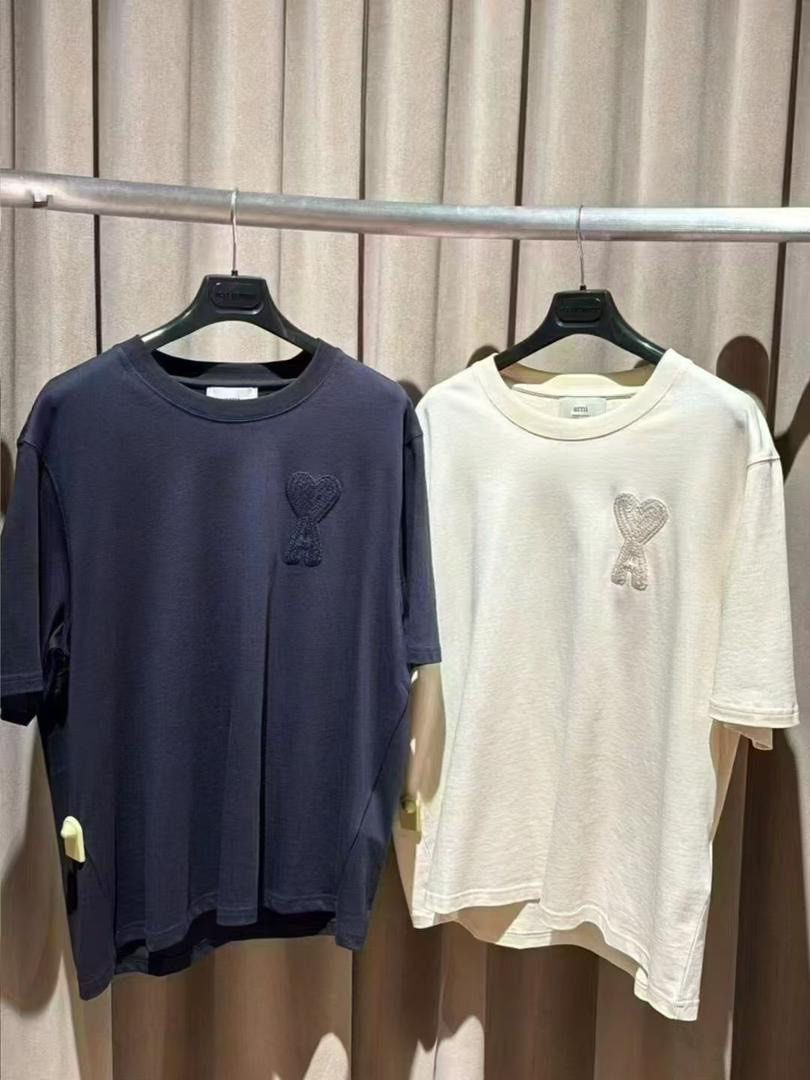AMI Paris Heart Logo T-shirt (Category: Luxury Apparel) located in San Pablo. Submitted by with.jacque (Listing ID 1414824192, Image 1). Description: - AMI Paris t-shirt - Features heart logo on chest - Available colors: Navy blue, Off-white - Style: Crew neck, short sleeves - Fabric: Soft and comfortable - Perfect for casual wear All sizes available: xxs to xL Over sized.