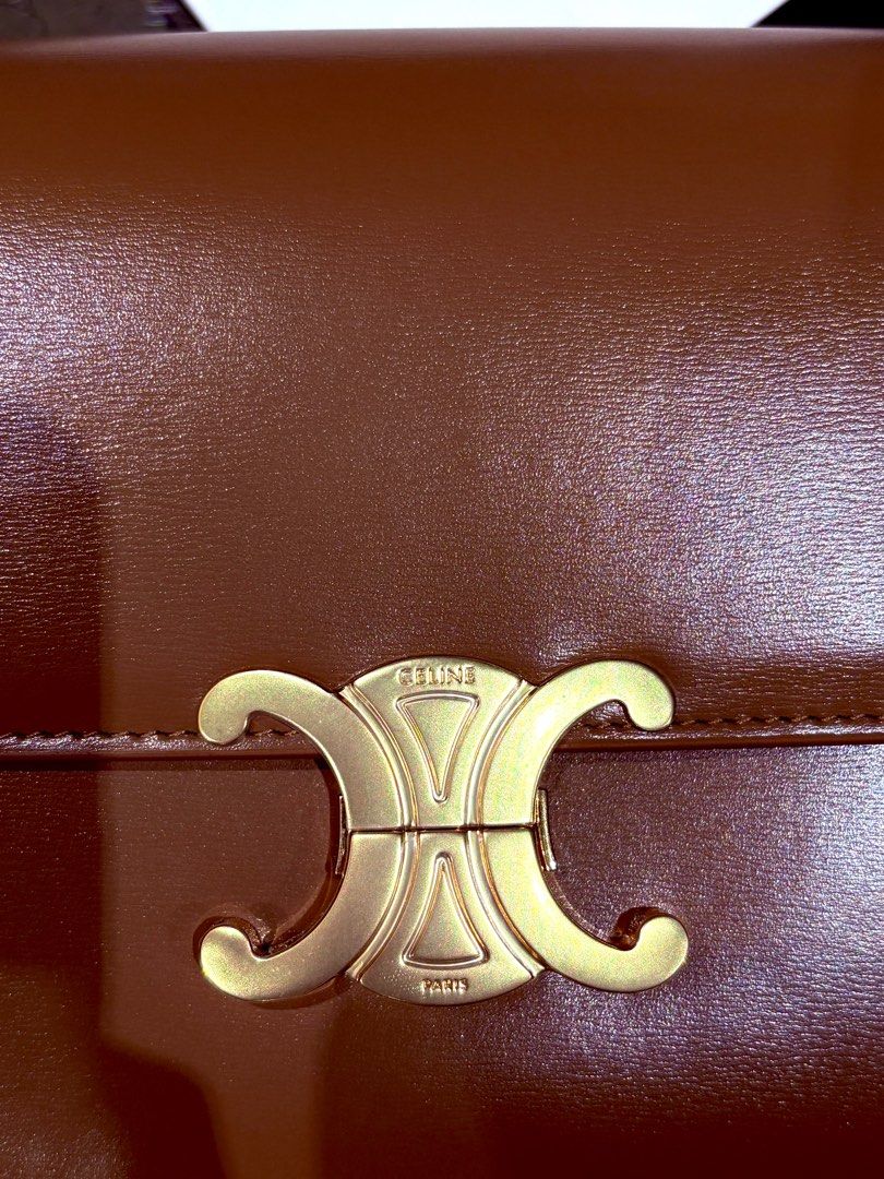Celine Triomphe bag medium (Category: Luxury Bags & Wallets) located in Quezon City. Submitted by herluxe_official (Listing ID 1414752658, Image 2). Description: CELINE TEEN TRIOMPHE BAG IN SHINY CALFSKIN Calfskin leather ❌Selling lower than market price❌ Complete inclusions: Dustbag, box, booklet and cards included .