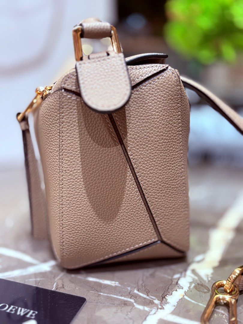 Loewe small puzzle bag in sand with entrupy (Category: Luxury Bags & Wallets) located in Quezon City. Submitted by herluxe_official (Listing ID 1414740378, Image 3). Description: Complete inclusions: dustbag, box, paperbag, authenticity cards and sling strap included. With entrupy ❌RUSH SALE, Priced below market ❌.