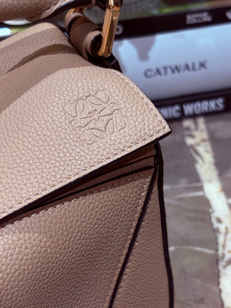 Loewe small puzzle bag in sand with entrupy (Category: Luxury Bags & Wallets) located in Quezon City. Submitted by herluxe_official (Listing ID 1414740378, Image 2). Description: Complete inclusions: dustbag, box, paperbag, authenticity cards and sling strap included. With entrupy ❌RUSH SALE, Priced below market ❌.