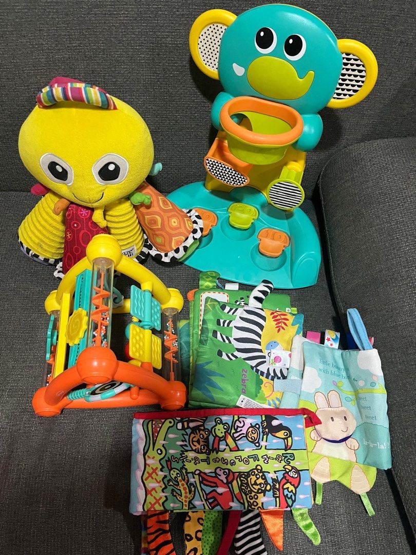 Baby Toys Bundle (Category: Infant Playtime) located in Manila. Submitted by lars13 (Listing ID 1414698896, Image 1). Description: - Elephant-shaped toy with basketball hoop no more ball - Yellow octopus plush lamaze - Colorful activity center - Soft fabric books with animal and character designs - Designed to stimulate and entertain babies.