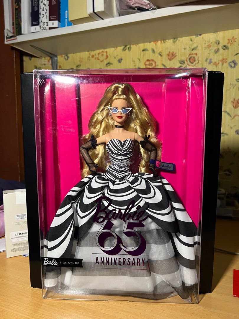 Barbie 65th Anniversary Doll (Category: Figurines & Statues) located in Marikina City. Submitted by lamikiminache (Listing ID 1414738197, Image 1). Description: Unboxed once. wysiwyg Box still in fair condition Mop: Gcash Shipping fee will be shouldered by buyer - Barbie 65th Anniversary Signature Doll - Elegant black and white gown - Iconic blonde hair and sunglasses - Brand new, in original packaging - A must-have for Barbie collectors! .